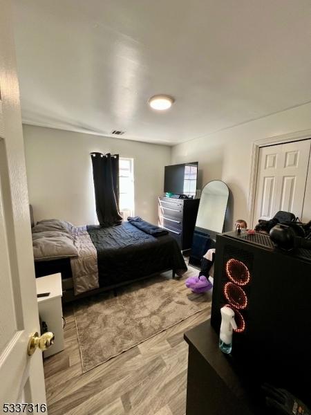 bedroom with light hardwood / wood-style flooring