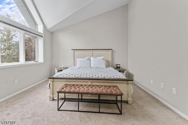 carpeted bedroom featuring vaulted ceiling