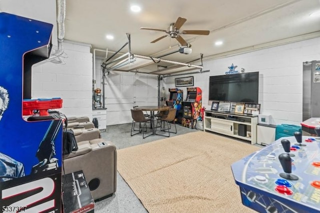 recreation room featuring concrete flooring and ceiling fan