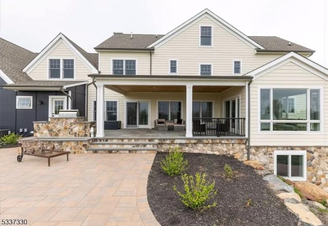 rear view of house featuring a patio