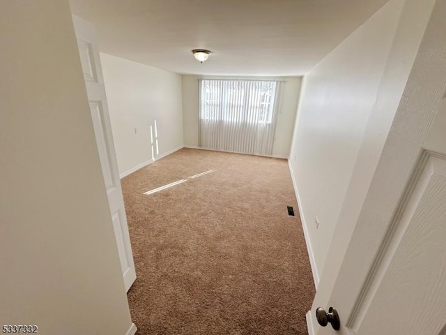 unfurnished room featuring carpet floors