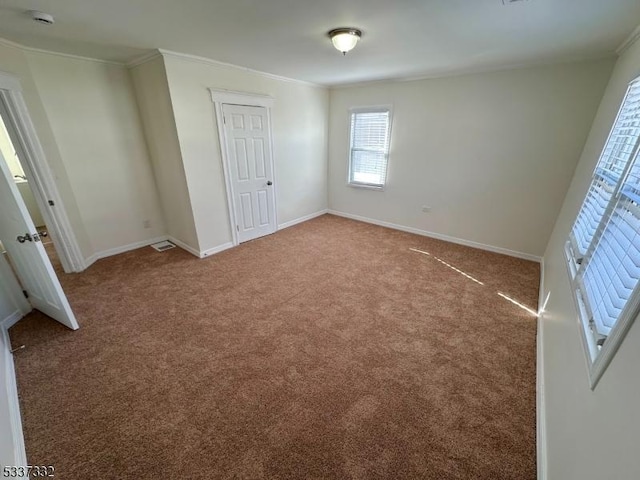 unfurnished bedroom featuring carpet floors and ornamental molding