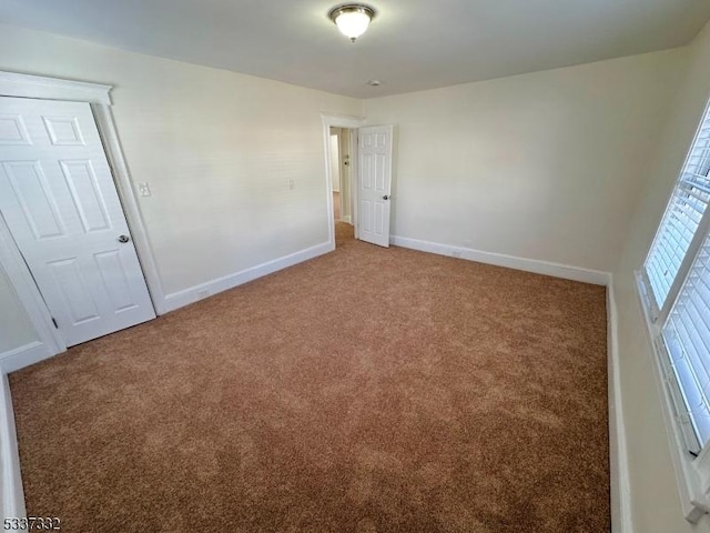 unfurnished bedroom with carpet flooring