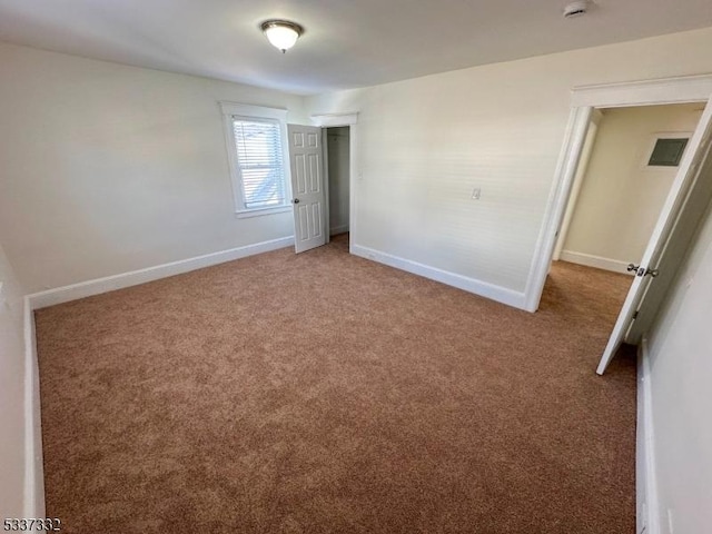 unfurnished bedroom with carpet flooring