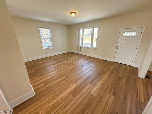 foyer entrance featuring hardwood / wood-style flooring