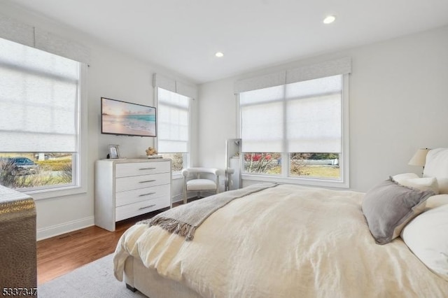 bedroom featuring recessed lighting, baseboards, and wood finished floors