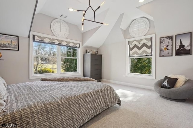 bedroom featuring vaulted ceiling, multiple windows, carpet flooring, and visible vents