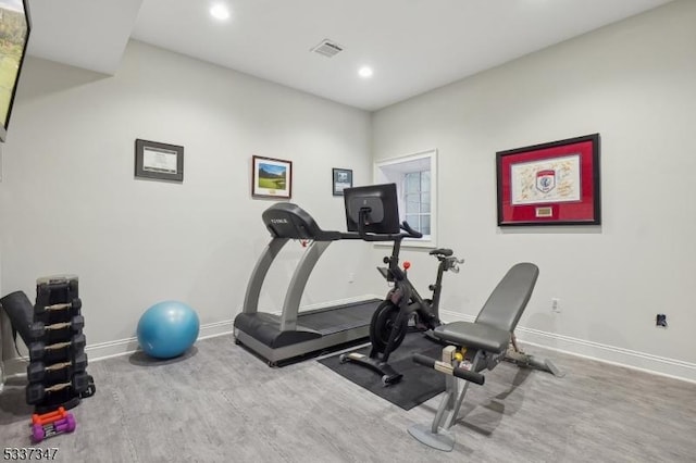 workout area with recessed lighting, wood finished floors, visible vents, and baseboards