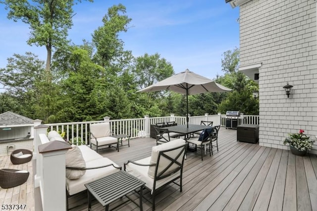 wooden terrace featuring outdoor dining space