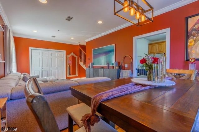 dining area featuring a chandelier, recessed lighting, visible vents, and crown molding