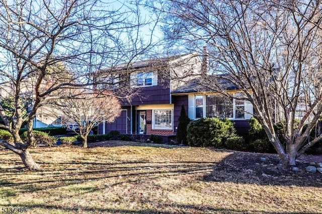 view of front of house with a front lawn