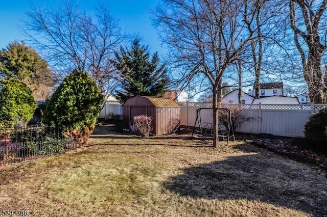 view of yard featuring a storage unit