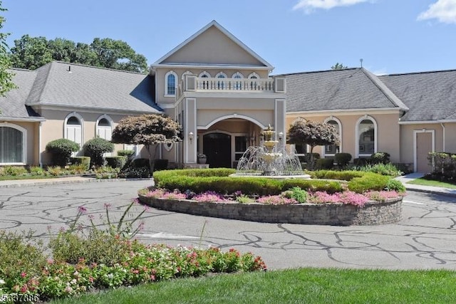 view of front of home with a balcony