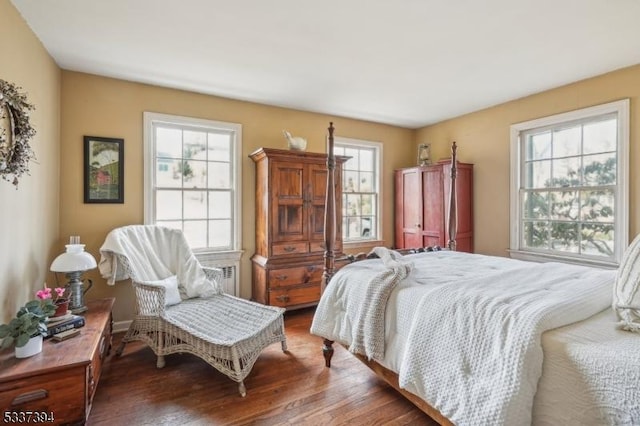 bedroom with wood finished floors