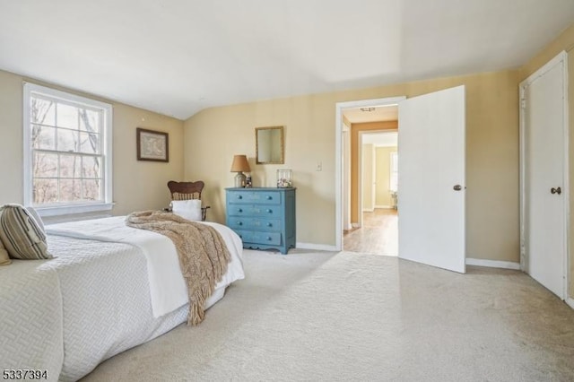 carpeted bedroom featuring baseboards