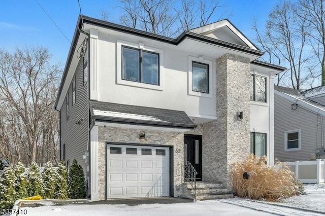 view of front of property with a garage