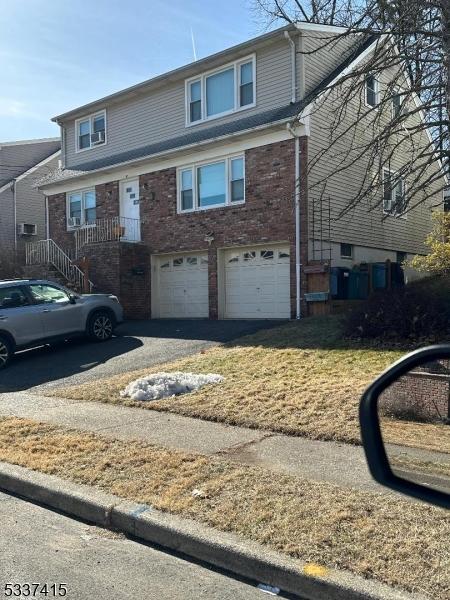 front of property with a garage