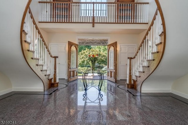 entryway with a high ceiling