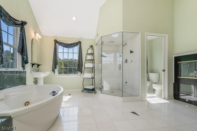 bathroom with tile patterned floors, toilet, independent shower and bath, and high vaulted ceiling