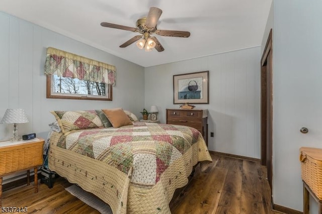 bedroom with dark wood-type flooring and ceiling fan