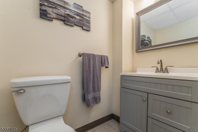 bathroom featuring tile patterned floors, vanity, and toilet