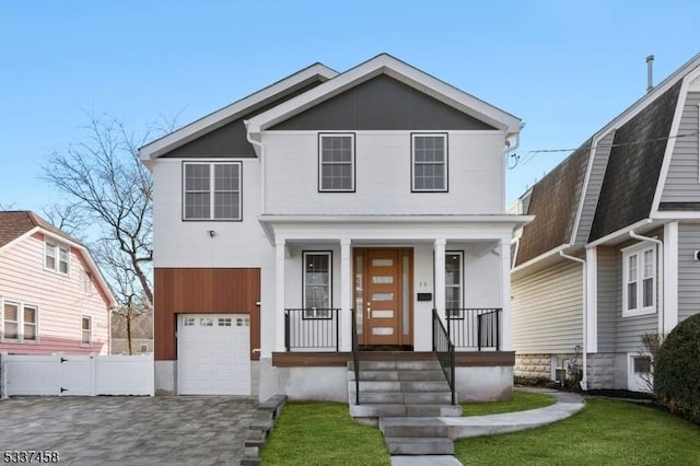 view of front property with a garage and a front lawn