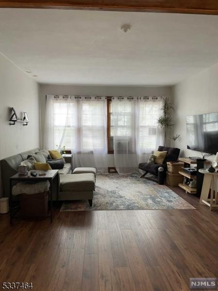 living room featuring dark hardwood / wood-style floors