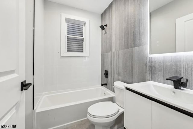 full bathroom with vanity, tile patterned floors, toilet, and shower / bath combination