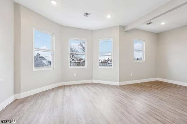 unfurnished room with light hardwood / wood-style flooring