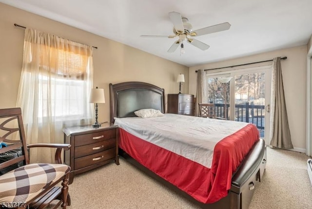 bedroom featuring multiple windows, light colored carpet, access to exterior, and ceiling fan