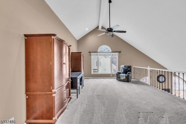 additional living space with lofted ceiling with beams, ceiling fan, and light carpet