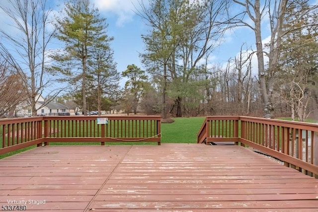 deck featuring a lawn