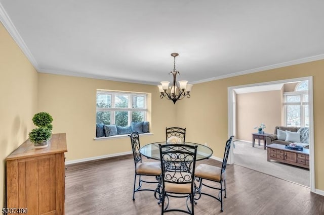 dining room with baseboards, dark wood finished floors, and a wealth of natural light