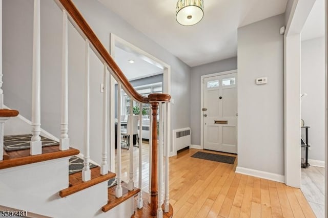 entryway featuring light wood-type flooring and radiator