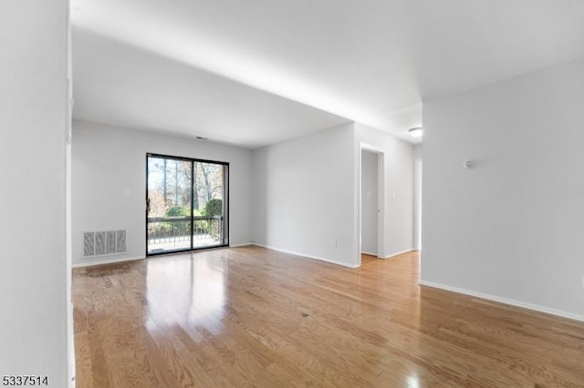 empty room with light wood-type flooring