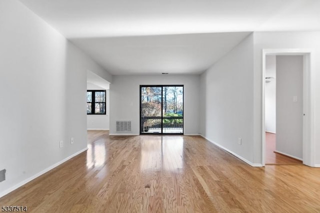 unfurnished living room with light hardwood / wood-style flooring