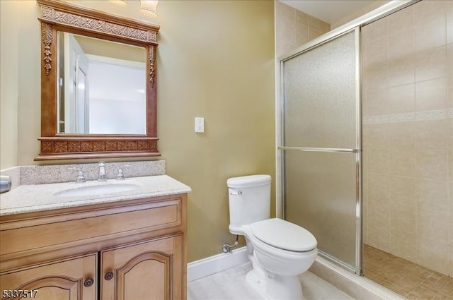 bathroom featuring vanity, toilet, and walk in shower