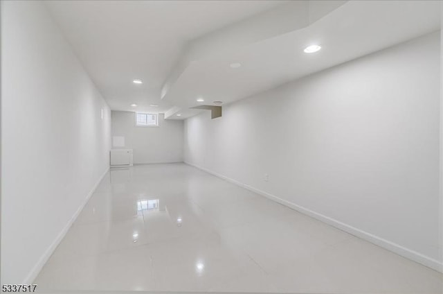 basement with light tile patterned flooring