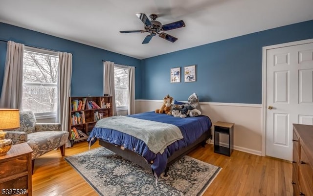 bedroom with ceiling fan and light wood-type flooring