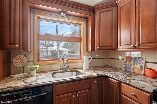 kitchen with light stone counters, sink, backsplash, and dishwasher