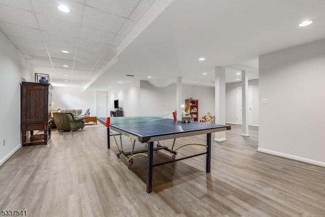 playroom featuring light wood-style floors, recessed lighting, a drop ceiling, and baseboards