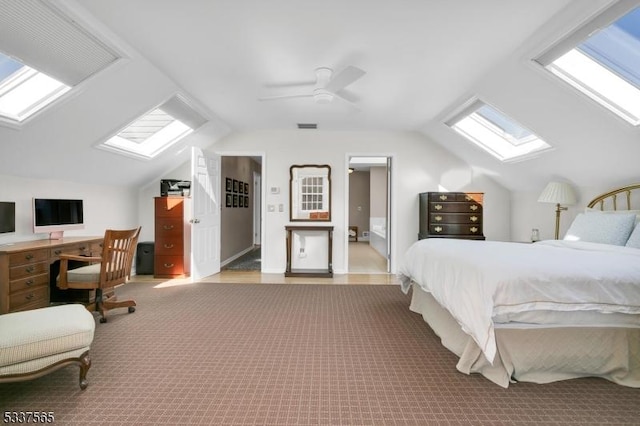 bedroom with vaulted ceiling with skylight, visible vents, a ceiling fan, and light colored carpet