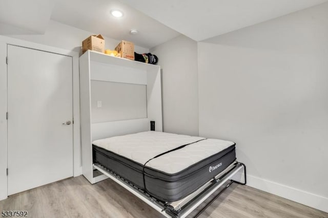 bedroom with light wood-type flooring