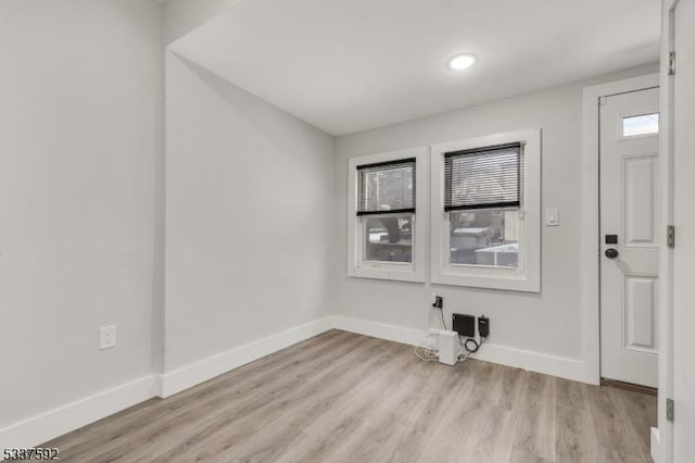 spare room featuring light hardwood / wood-style floors