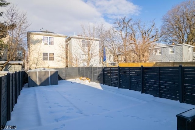 view of yard layered in snow