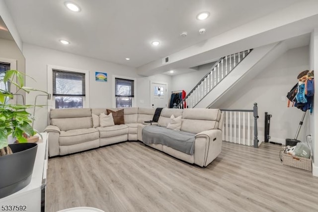 living room with light hardwood / wood-style flooring and plenty of natural light