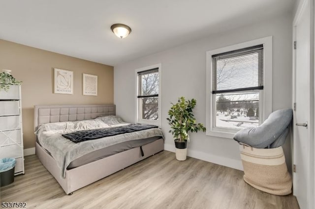 bedroom with light hardwood / wood-style flooring