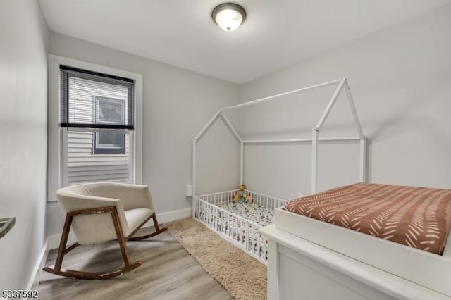 bedroom featuring hardwood / wood-style floors