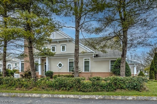 view of front of home featuring brick siding