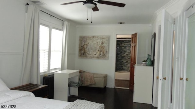 bedroom with dark wood finished floors, visible vents, multiple windows, and ornamental molding